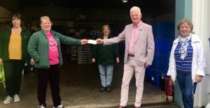 Secretary Stuart Kane passing over a cheque for £400 to South Ayrshire Foodbank